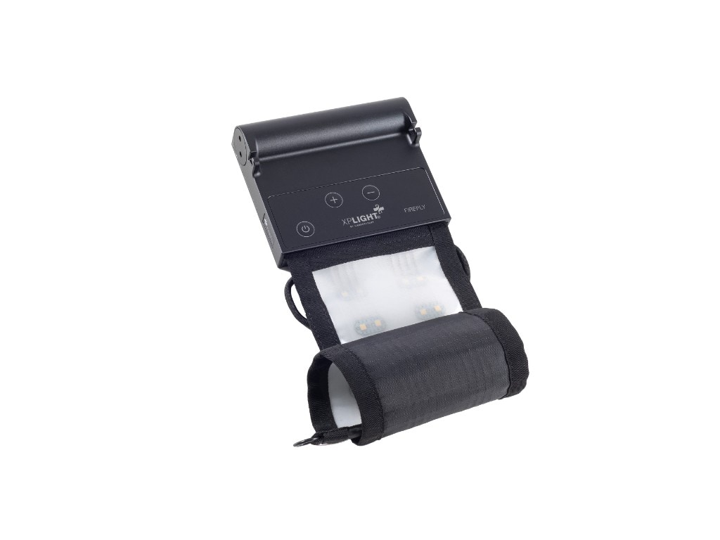 XP FIREFLY wearable LED device with control module on a white background